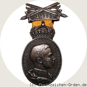 Ovale Herzog-Carl-Eduard-Medaille mit Schwerterspange und Datumsband 1915